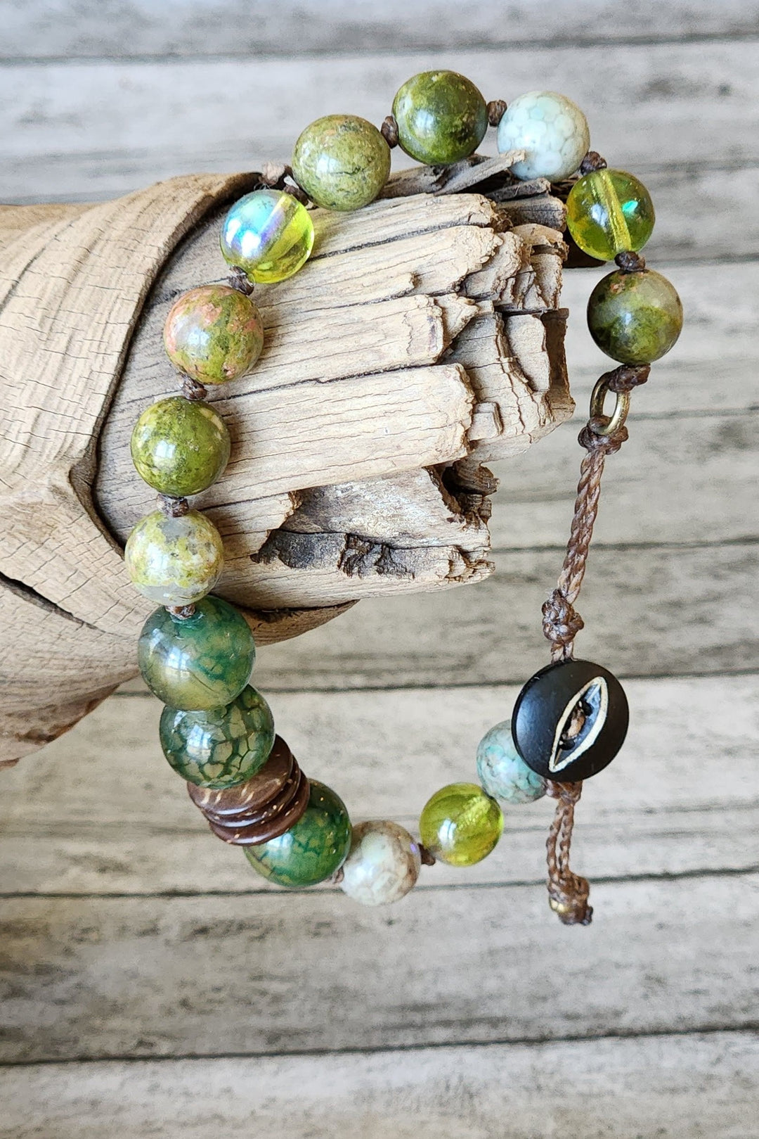 This photo shows the many shapes, colors, and textures of the Iguana Eye bracelet.