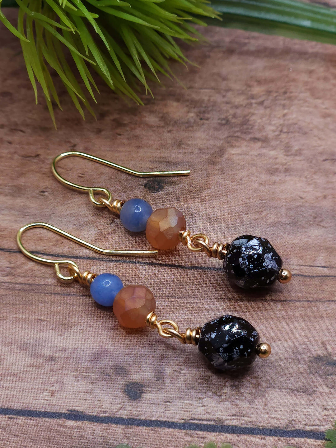 These petite earrings capture the blue, orange, and black colors of the American Kestral, with gold filled ear wires. 