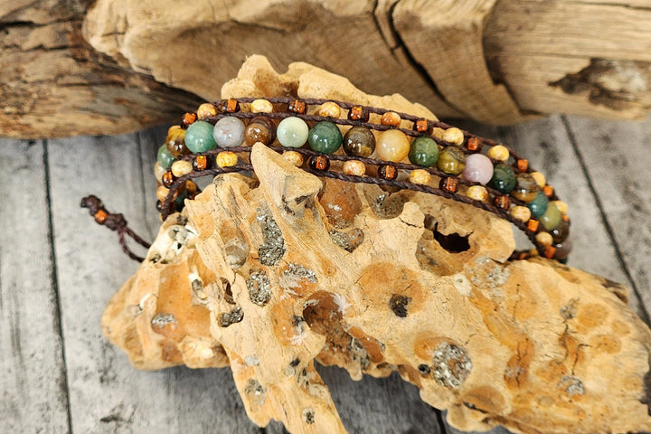 This photo displays the Moose Loom Bracelet on a textured piece of wood. This photo also shows of the beautiful fancy Jasper and Czech glass seed beads that make up the bracelet.  