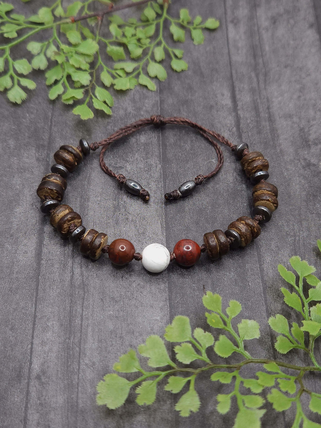 This photo of the Red Panda Bracelet shows the unique mix of wood and gemstone beads that makeup the bracelet.  