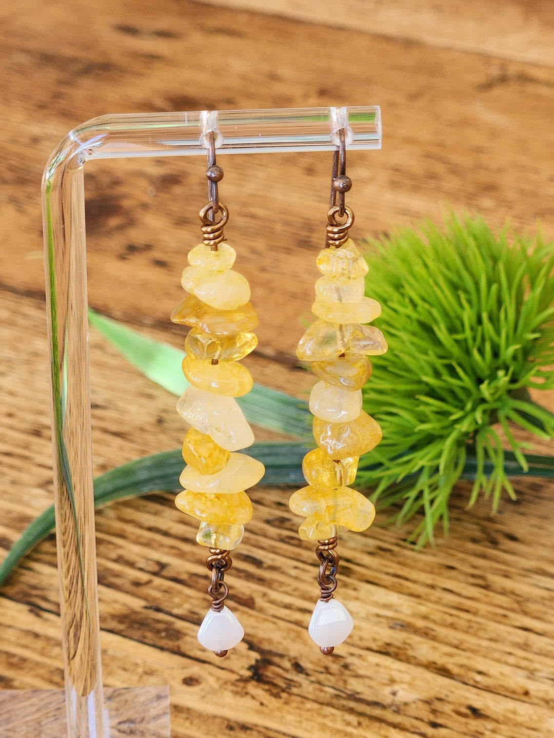 This photo highlights the unique texture of the Yellow Warbler Earrings. 