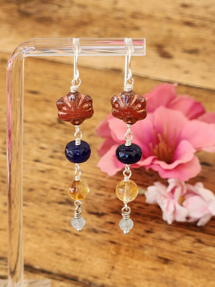 This is a closeup photo of the Sonoran Sunset Earrings showcasing the unique shapes and colors of these earrings. 