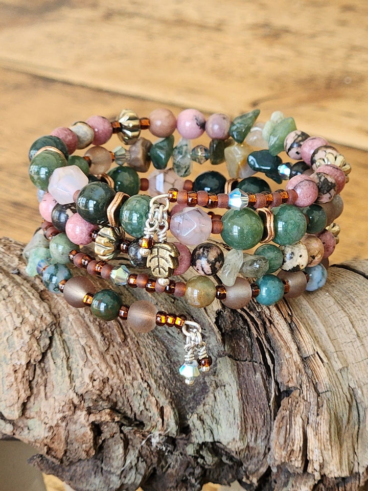 This is a close-up of the Yosemite Valley memory wire bracelet that highlights the pink, green, brown color pallet of the bracelet.  